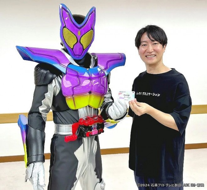 Kamen Rider Gavv receives a Japan Gummy Association membership card with the member number [202491], reflecting the show's broadcast date.