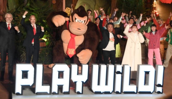 Shigeru Miyamoto and Donkey Kong at the pre-opening event for the Donkey Kong Country expansion of Super Nintendo World.